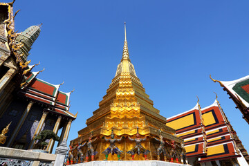 Fototapeta premium Beautiful of demon guardian statues at the gate giant sculpture lifting pagoda at wat phra kaew, Bangkok of Thailand