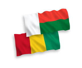Obraz premium Flags of Guinea and Madagascar on a white background