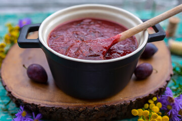 Homemade plum jam in a pot.