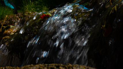 water falling down small stone