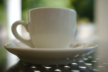 Glossy white cup of Italian coffee