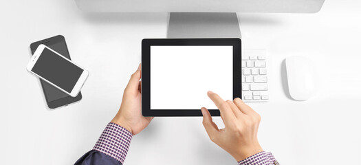 Hands holding tablet touch computer gadget with isolated screen