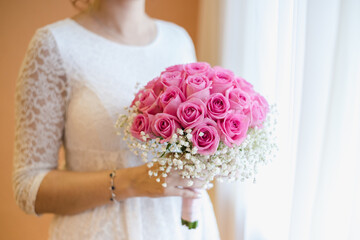 bride holding bouquet, bouquet of pink roses, wedding day, the bride's bouquet