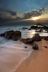 Dramatic seascape of Sea waves crashing against rocks in Krating Bay at beautiful sunset in Chanthaburi, Thailand, summer sea concept
