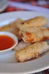 (Cha Gio Re) Vietnamese net spring rolls with dipping sauce.