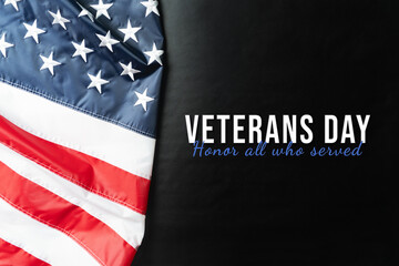 Fototapeta na wymiar Veterans day. Honoring all who served. American flag on black background.
