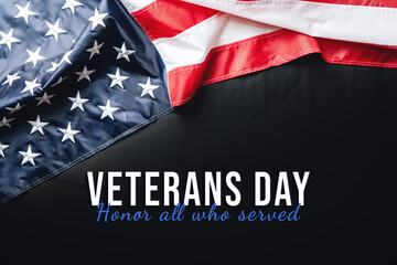 Veterans day. Honoring all who served. American flag on black background.