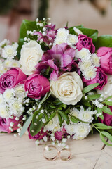 bouquet of pink roses, bridal bouquet of roses, bridal bouquet with wedding rings, wedding rings