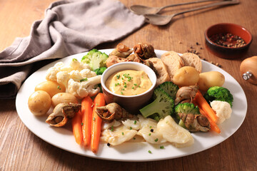 platter of vegetable, seafood and dip sauce