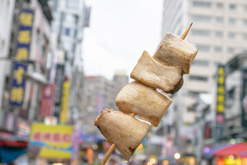 The close up of Taiwanese traditional barbecue (BBQ) food  at night market background in Taiwan. 
