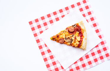 Top view a piece of pizza on colorful paper.Simple food and eating