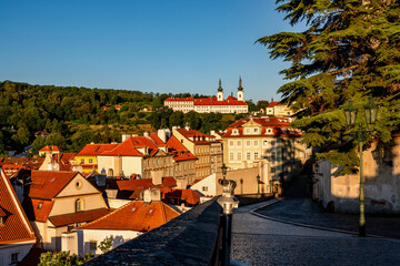 Obraz premium Red roof of historical buildings of Prague Lesser town, Strahov monastery and Petrin hill, Prague.
