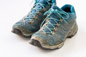 A pair of mountain shoes very used and dirty