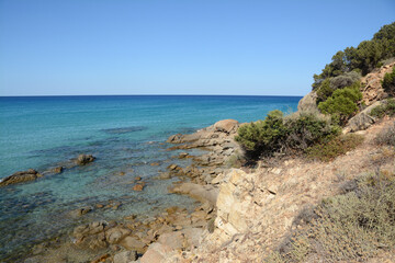 Wonderful Sardinia with the scents of the Mediterranean scrub with evergreen bushes and conifers and the turquoise blue of its crystalline waters.