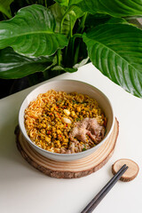 Beef noodle and clam with green leaf nature background