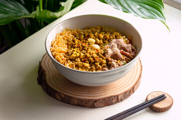 Beef noodle and clam with green leaf nature background