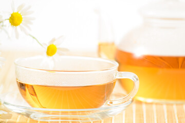 teacup with herbal chamomile tea