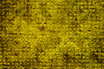 Yellow colored wall texture background with textures of different shades of yellow