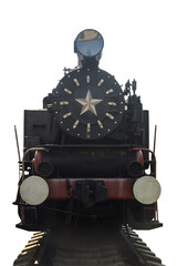 An old steam locomotive stands in the bright sun on rails on a clean white background with clipping. Photographed from the front