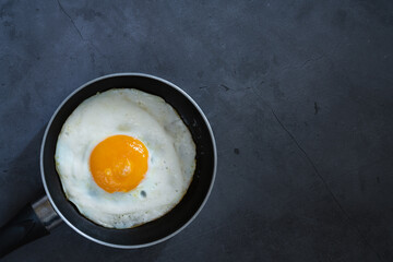 Pan omelette on black background