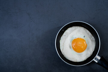 Pan omelette on black background
