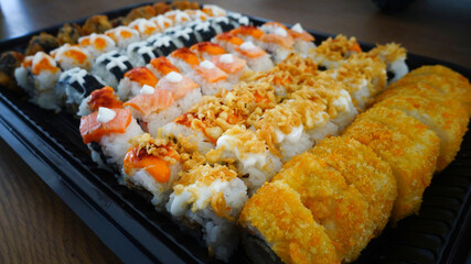 various of sushi roll are ready to be served                               