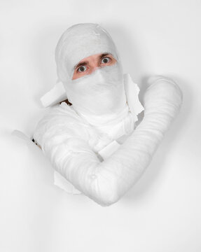 Boy In Bandage Put Out From Hole In Paper