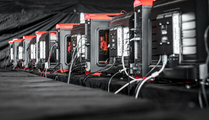 A data server farm. Close up of mining terminals for cryptocurrency precessing and stock market fluctuations. Big data concept, net computing, render farm, lan party.