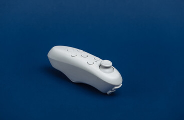 Modern joystick on classic blue background