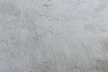 Texture of the wall plastered with cement grey plaster