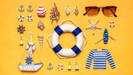 Various decorative nautical items, sailboat, life buoy and sunglasses on bright yellow background. Text WELCOME ABOARD. Sea travel, summer vacation at ocean concept. Flat lay, top view © Tatyana_Andreyeva