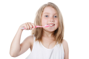 girl holding a toothbrush near her mouth