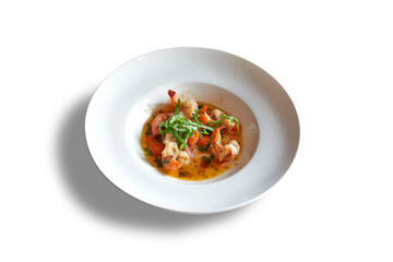 White round plate whith garlic shrimps.
