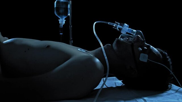 Coronavirus Male Patient On Respiratory Medical System In Hospital.