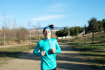 Fitness girl training running in the morning park
