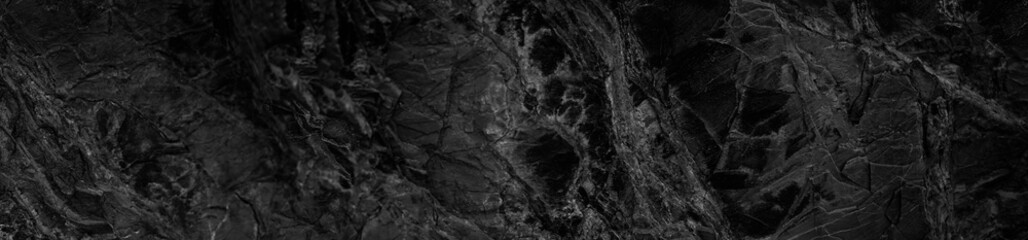 Black and white abstract background. Black stone rock grunge background. Dark rock texture.