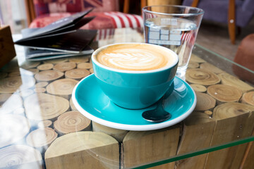 Coffee time - chasing the sun in cup of excellent cappuccino coffee