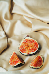 Fig in a cut on a satin fabric
