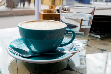 Coffee time - chasing the sun in cup of excellent cappuccino coffee