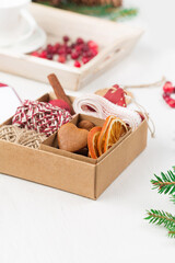Hand crafted christmas gift wrapping without plastic, gingerbread cookies, cranberries.