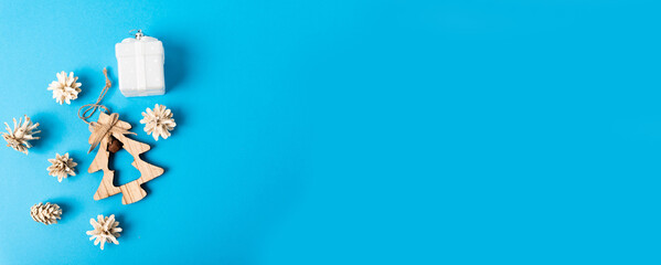 Christmas layout with a Christmas tree and a medical mask on a blue background