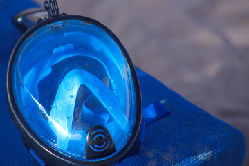 full face snorkeling mask on the beach.