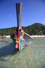 Close up view of Longtail boat sits at the beautiful Tonsai bay in Phi Phi island,  krabi province, Thailand 