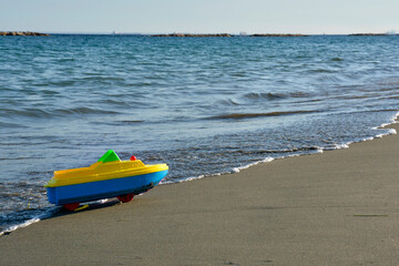Toy Boat Parked on a Sandy Mediterranean Beach