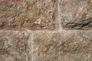 Texture of gray decorative stone wall made of large stones close up