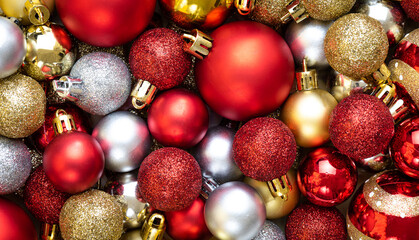 Christmas and New Year's composition. Top view of Christmas ball, pine cones and red berries as background.