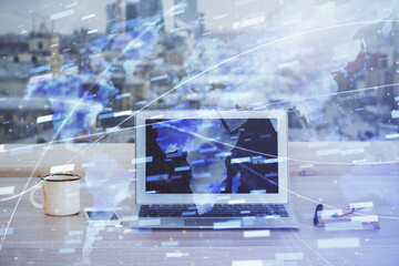 Double exposure of desktop computer and technology theme hologram. Concept of software development.