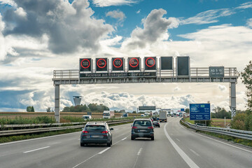 Stuttgart, Baden-Wuerttemberg, Germany 10-08-2020, sign bridge on German Autobahn with the Corona...