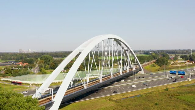 Muiderberg, Noord-Holland / The Netherlands - October 8th 2020: Train bridge Zandhazenbrug over the A1 from Amersfoort to Amsterdam