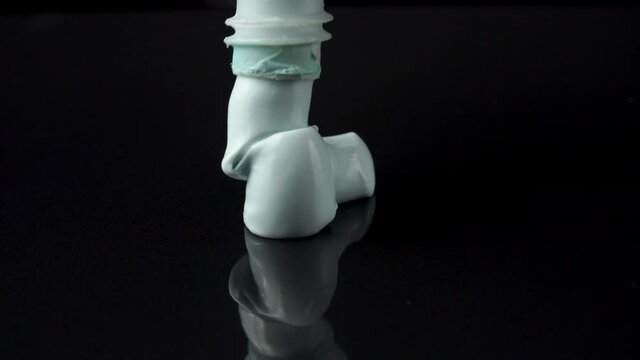 Close-up video of squeezed toothpaste